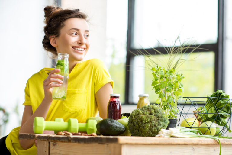 https://www.freepik.com/premium-photo/portrait-young-sports-woman-yellow-t-shirt-sitting-in- doors-with-healthy-food-dumbbells-table_18629784.htm